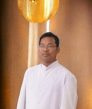 Dr. Fr. Jogesh B. Sangma, Principal of Don Bosco College Tura